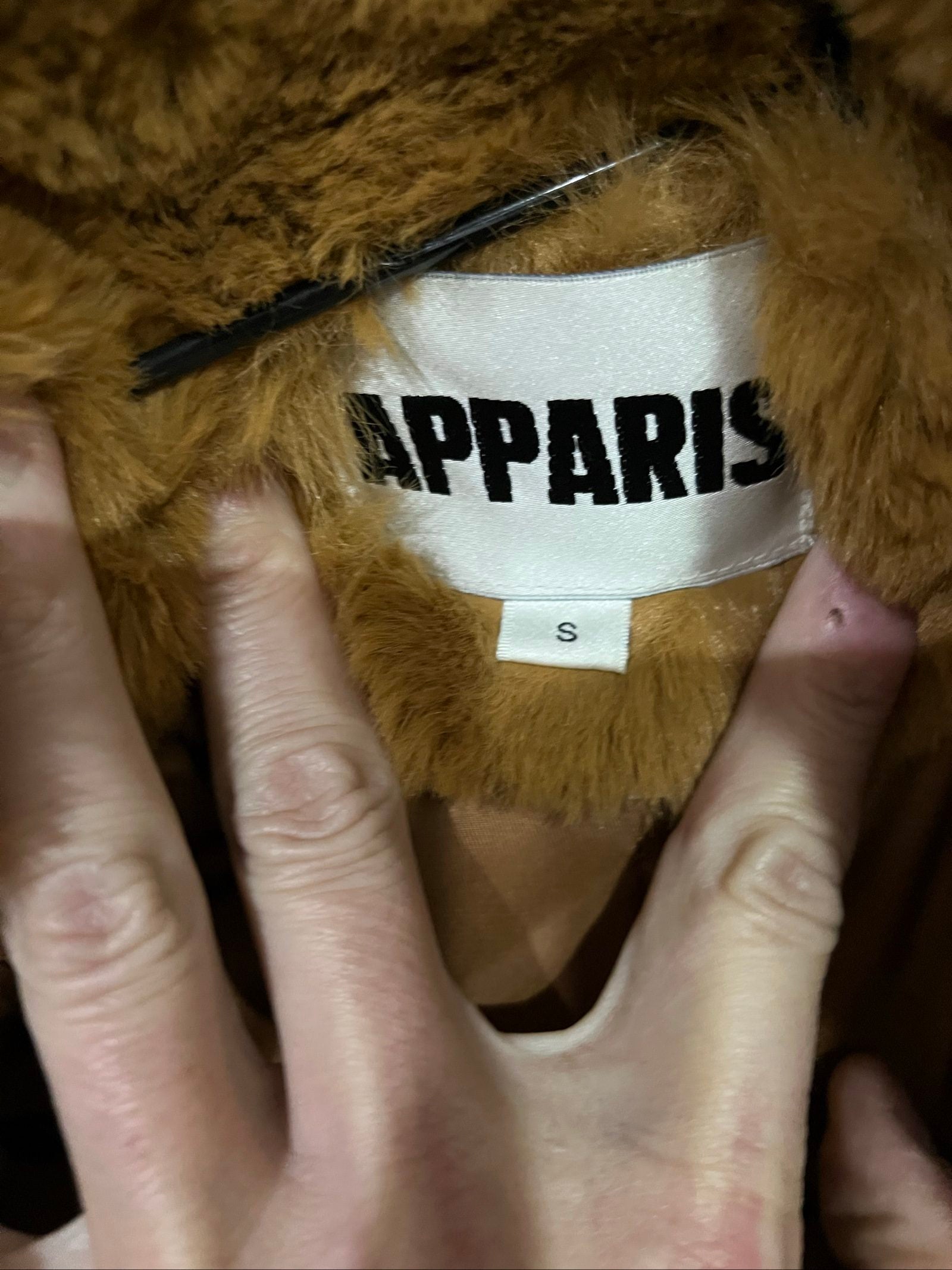 APPARIS brown faux fur coat with large lapels, plush texture, and two front pockets.