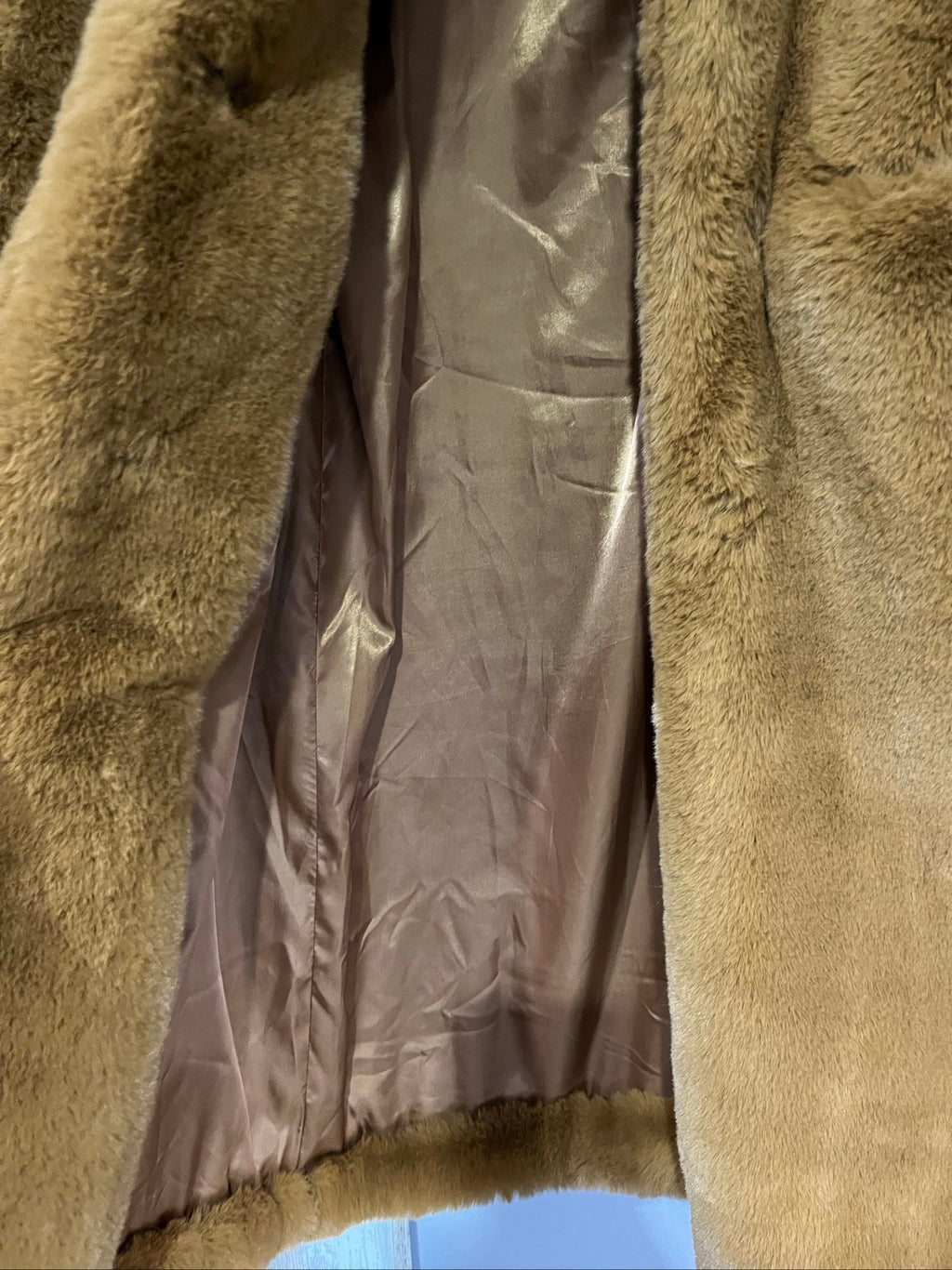 APPARIS brown faux fur coat with large lapels, plush texture, and two front pockets.