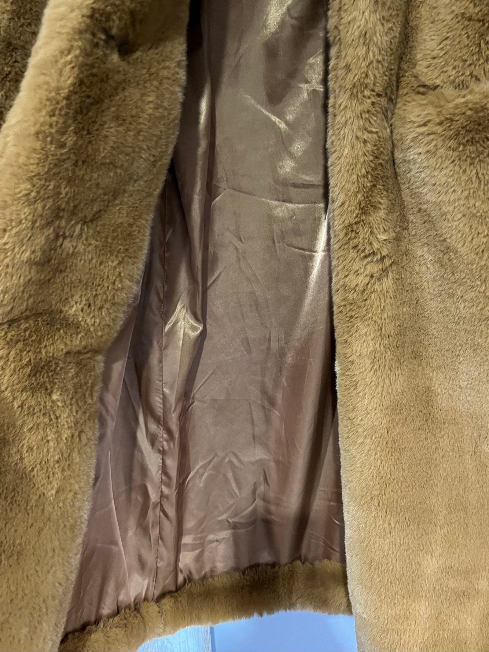 APPARIS brown faux fur coat with large lapels, plush texture, and two front pockets.