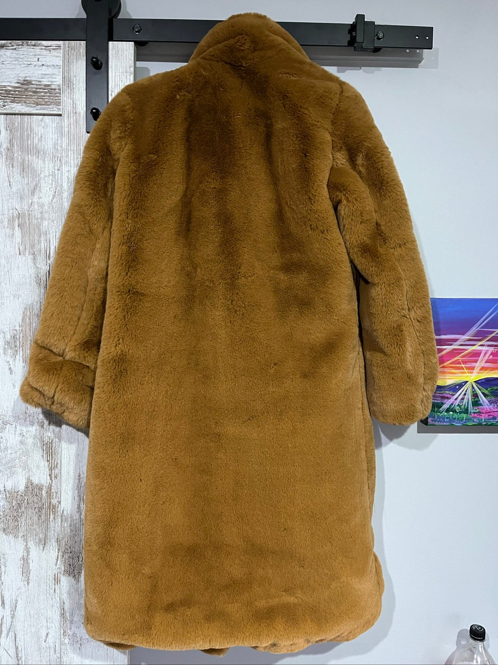 APPARIS brown faux fur coat with large lapels, plush texture, and two front pockets.