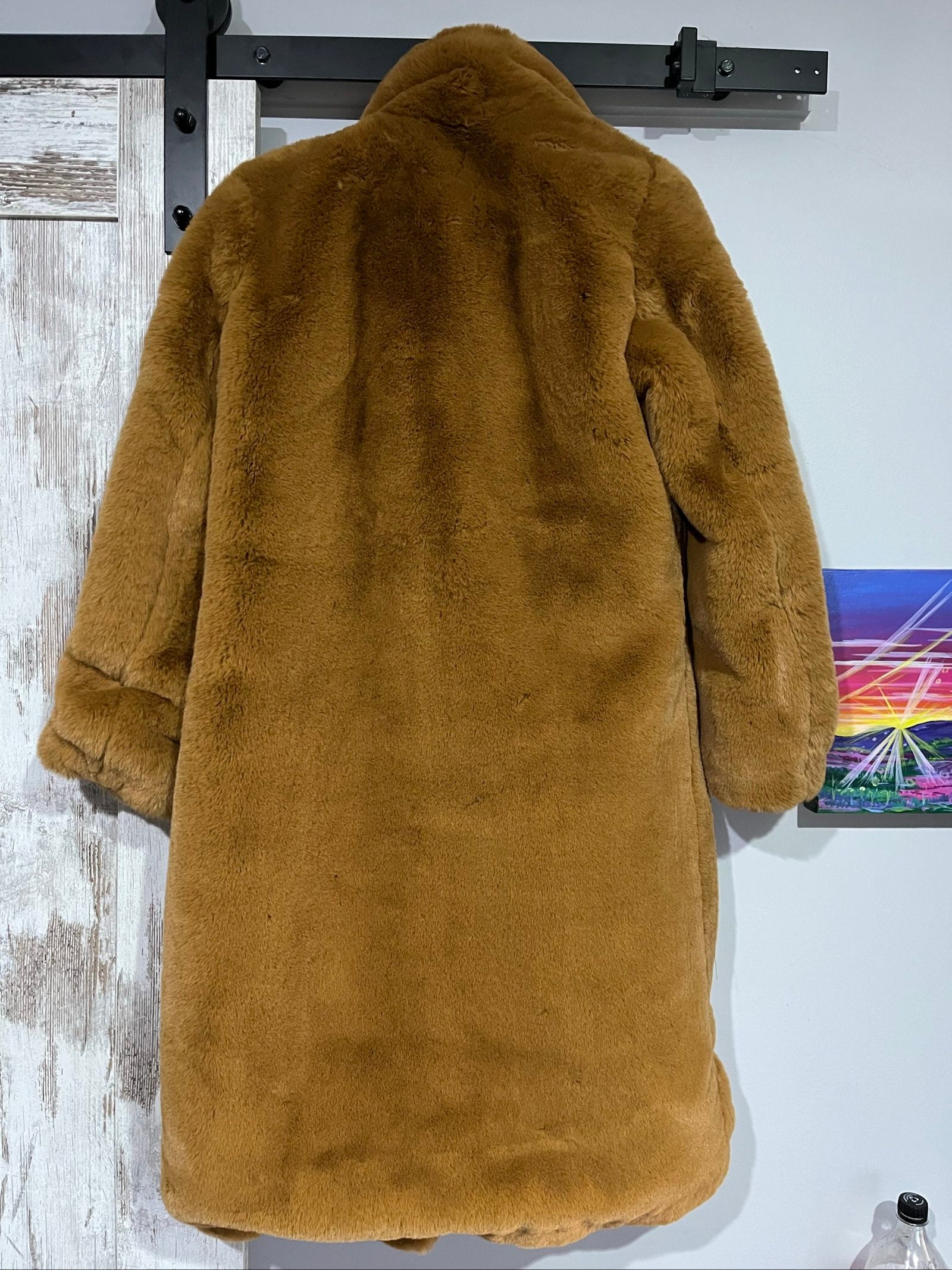 APPARIS brown faux fur coat with large lapels, plush texture, and two front pockets.