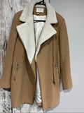 Sandro camel coat with white faux shearling collar and silver-tone zipper pockets.