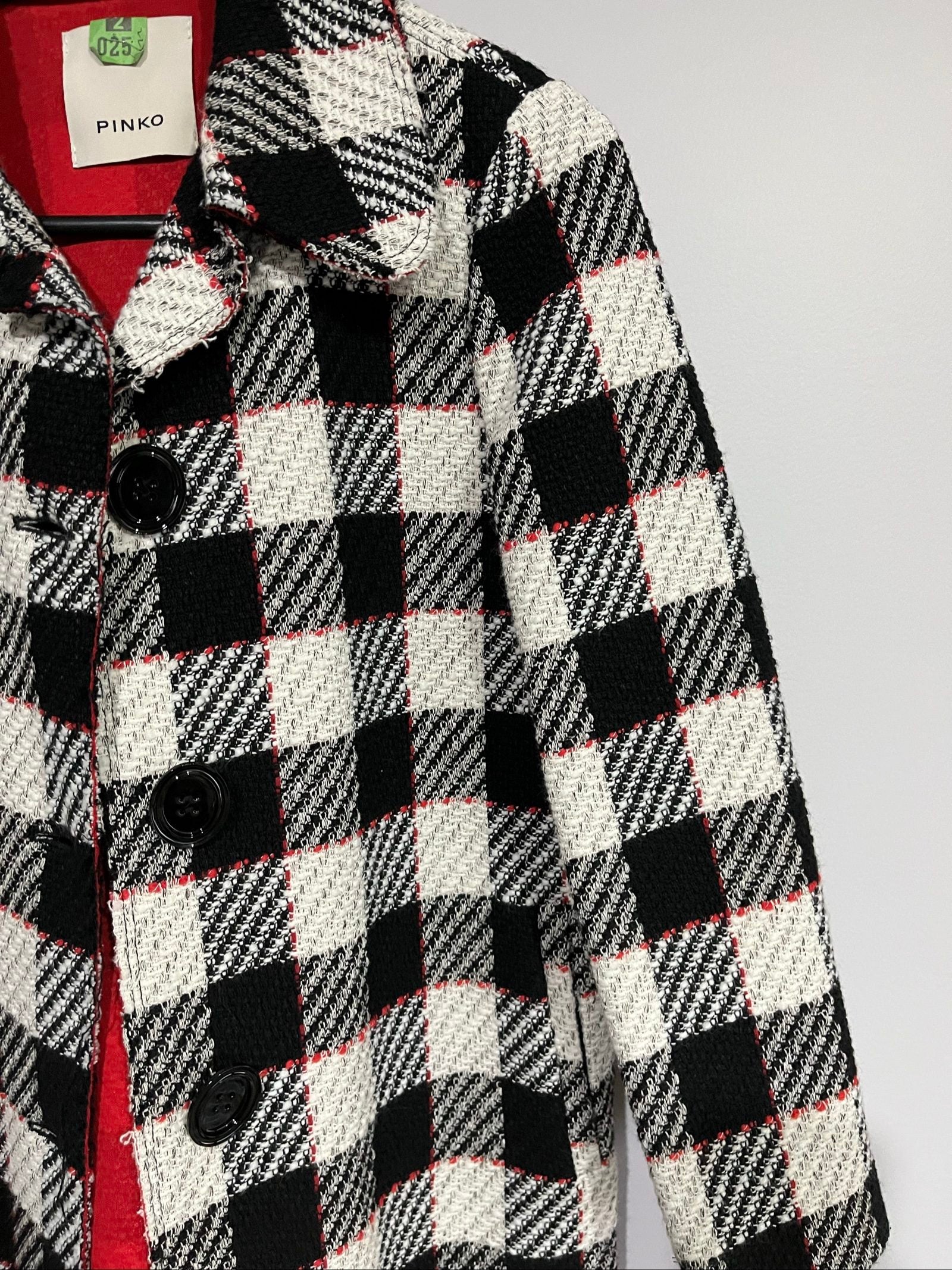 PINKO black and white checkered coat with red lining and black buttons.