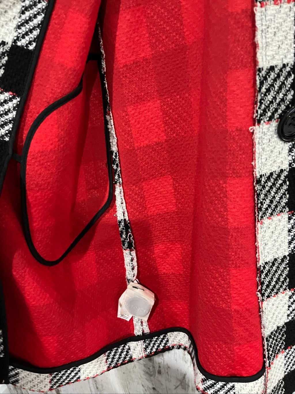 PINKO black and white checkered coat with red lining and black buttons.