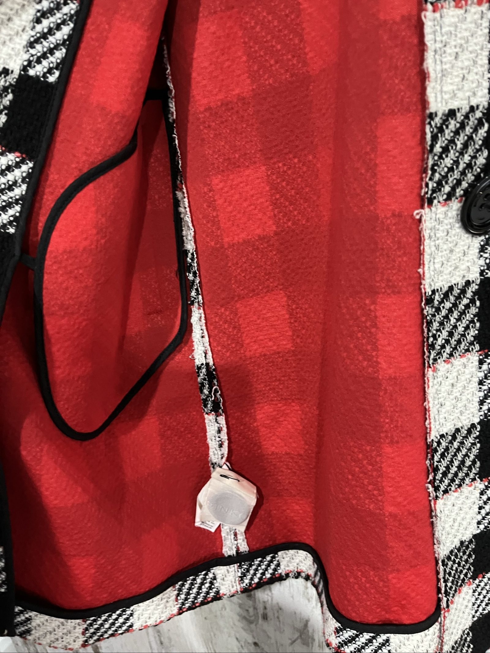 PINKO black and white checkered coat with red lining and black buttons.