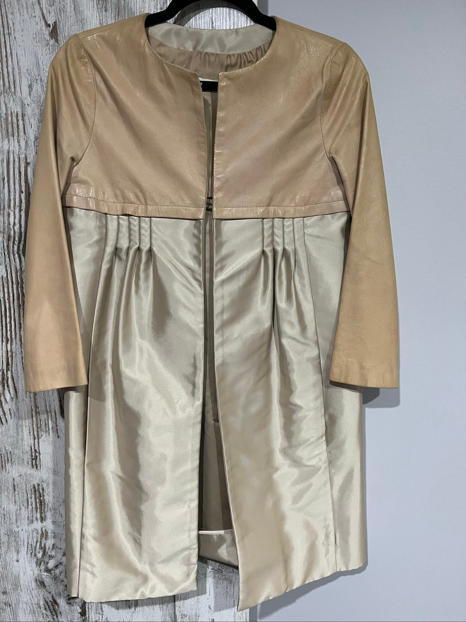 PINKO beige and cream coat with leather upper, pleated details, round neckline.